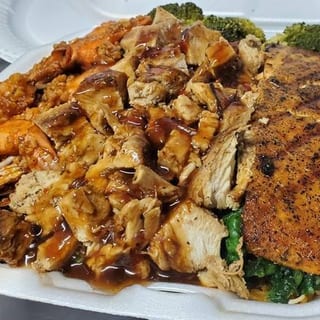 Jerk Chicken, Shrimp & Salmon Rice Platter